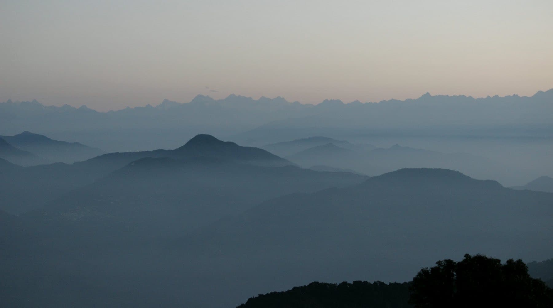 Still glacial lake beneath Himalayan peaks